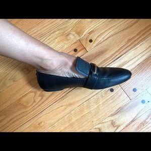 Calvin Klein black genuine leather loafers with gold accent.